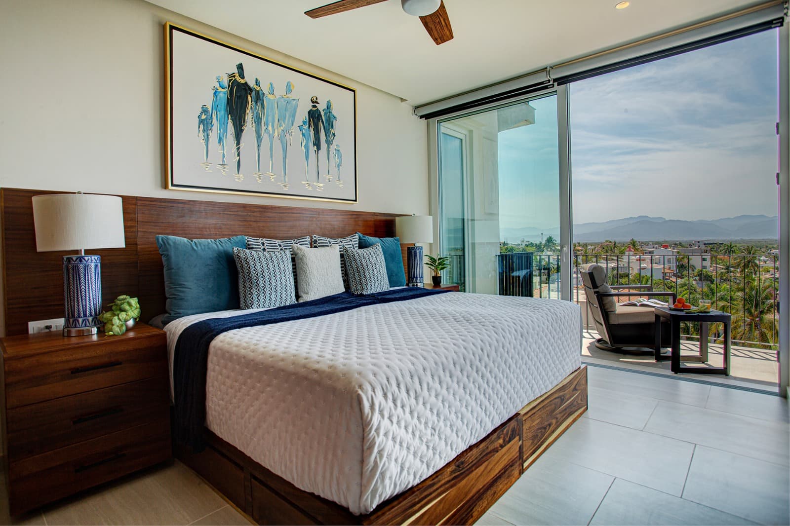 Guest Bedroom 2 is spacious and filled with natural light, offering beautiful views and a balcony. The bed can be configured as either two twins or one king, and a 55-inch TV makes it perfect for relaxing after a day out.