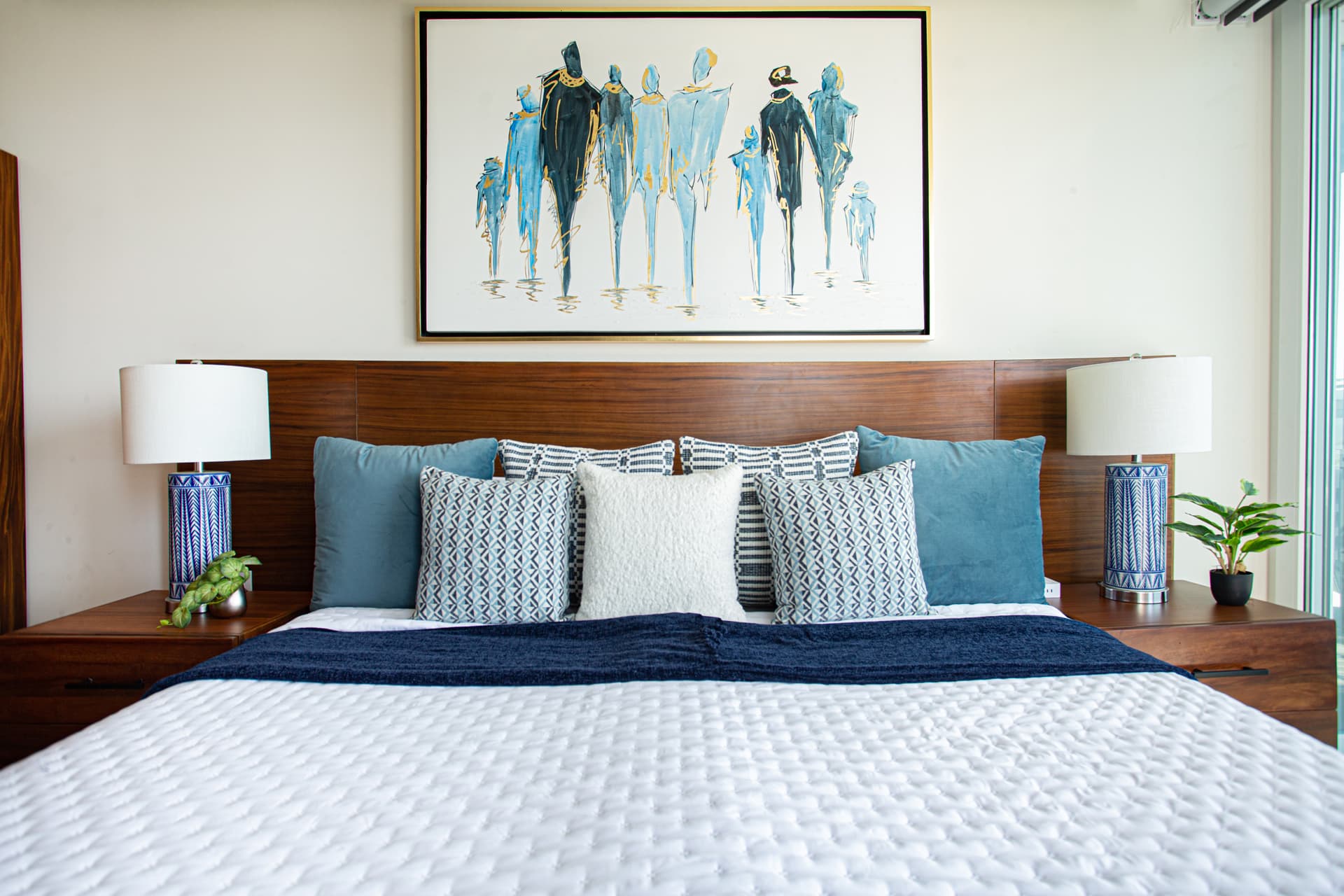 Guest Bedroom 2 is spacious and filled with natural light, offering beautiful views and a balcony. The bed can be configured as either two twins or one king, and a 55-inch TV makes it perfect for relaxing after a day out.
