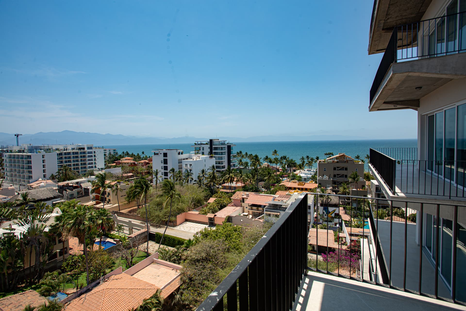 The guest bedroom balcony is made for moments — pull up a swivel chair, breathe in the ocean air, and let the views do the rest. The perfect way to start or end any day.