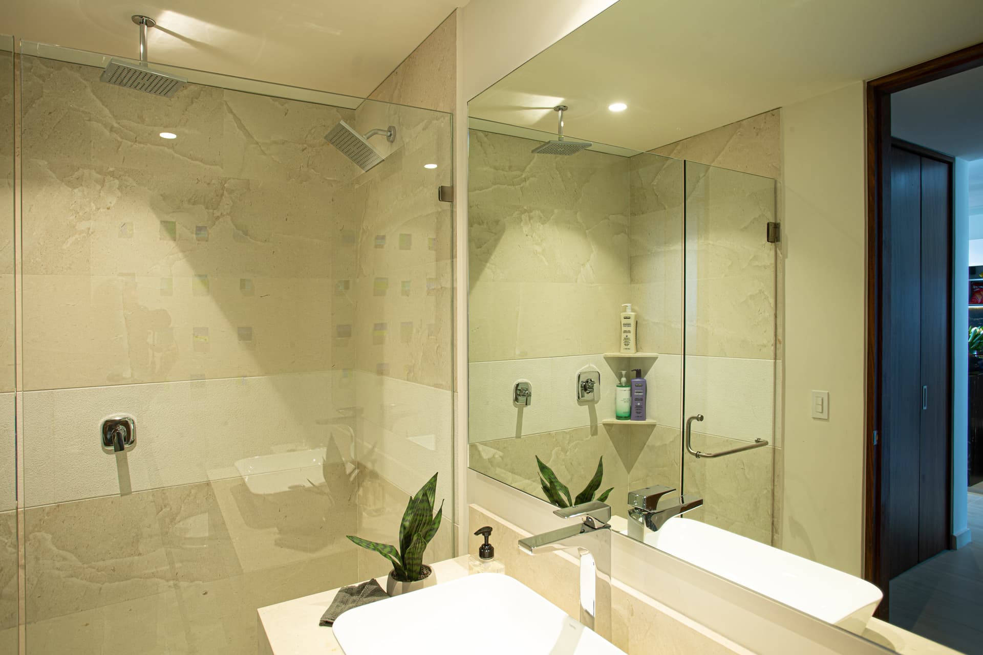 Hallway Bathroom: Spacious full bathroom features both a rain shower and wall shower, stocked with body wash, shampoo and conditioner so you can travel light and arrive ready to relax.