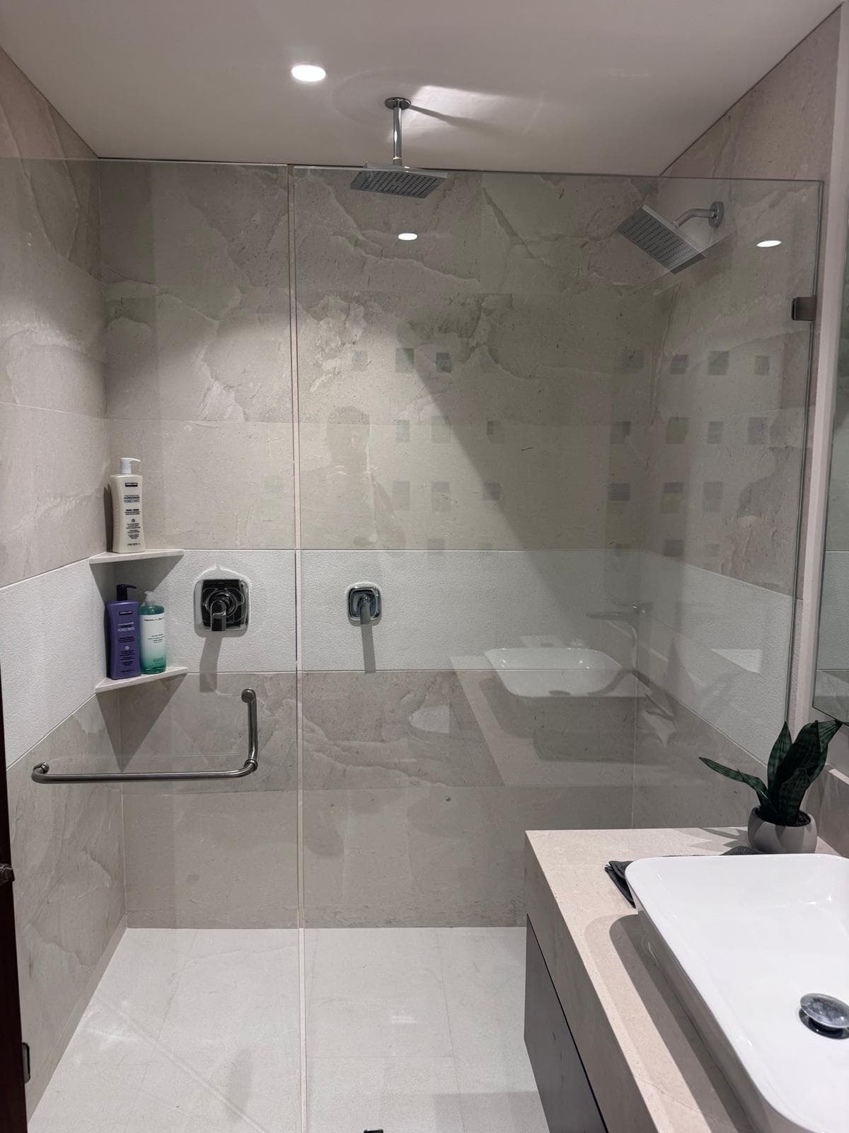 Hallway Bathroom: Spacious full bathroom features both a rain shower and wall shower stocked with body wash, shampoo and conditioner so you can travel light and arrive ready to relax.