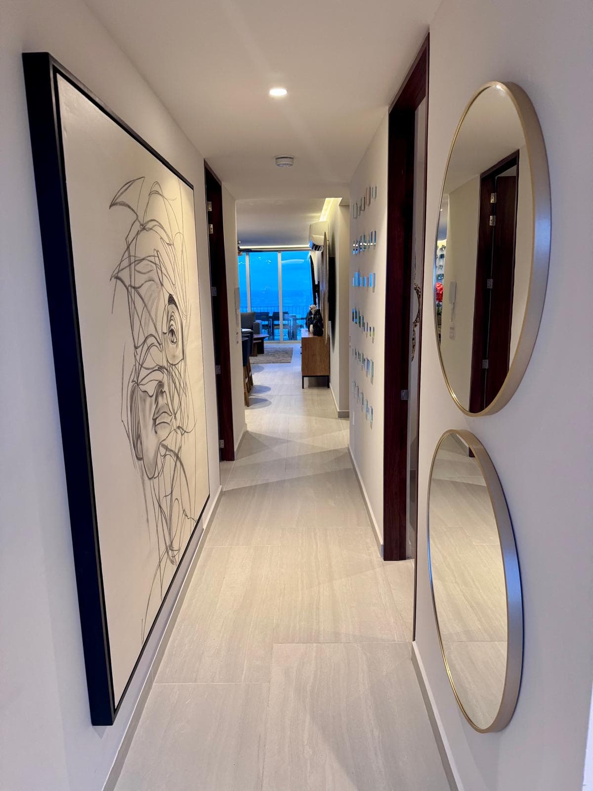 On the right is the study followed by Guest Bedroom 2 on the left. Further down the hall on the right is the laundry room with washer/dryer, detergent, softener, and dryer sheets, plus a guest bathroom with shower and vanity.