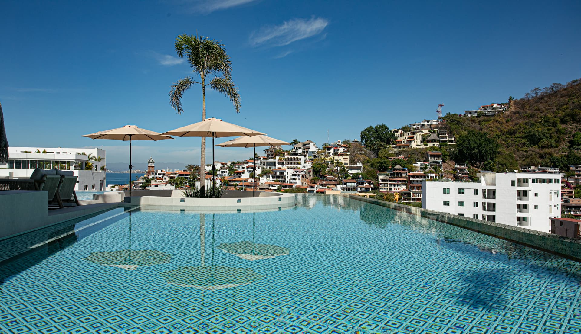 D'Vine is a stunning, state-of-the-art building just a 5-minute stroll from the beach, located in the vibrant heart of Puerto Vallarta's Romantic Zone, where modern luxury meets coastal charm.