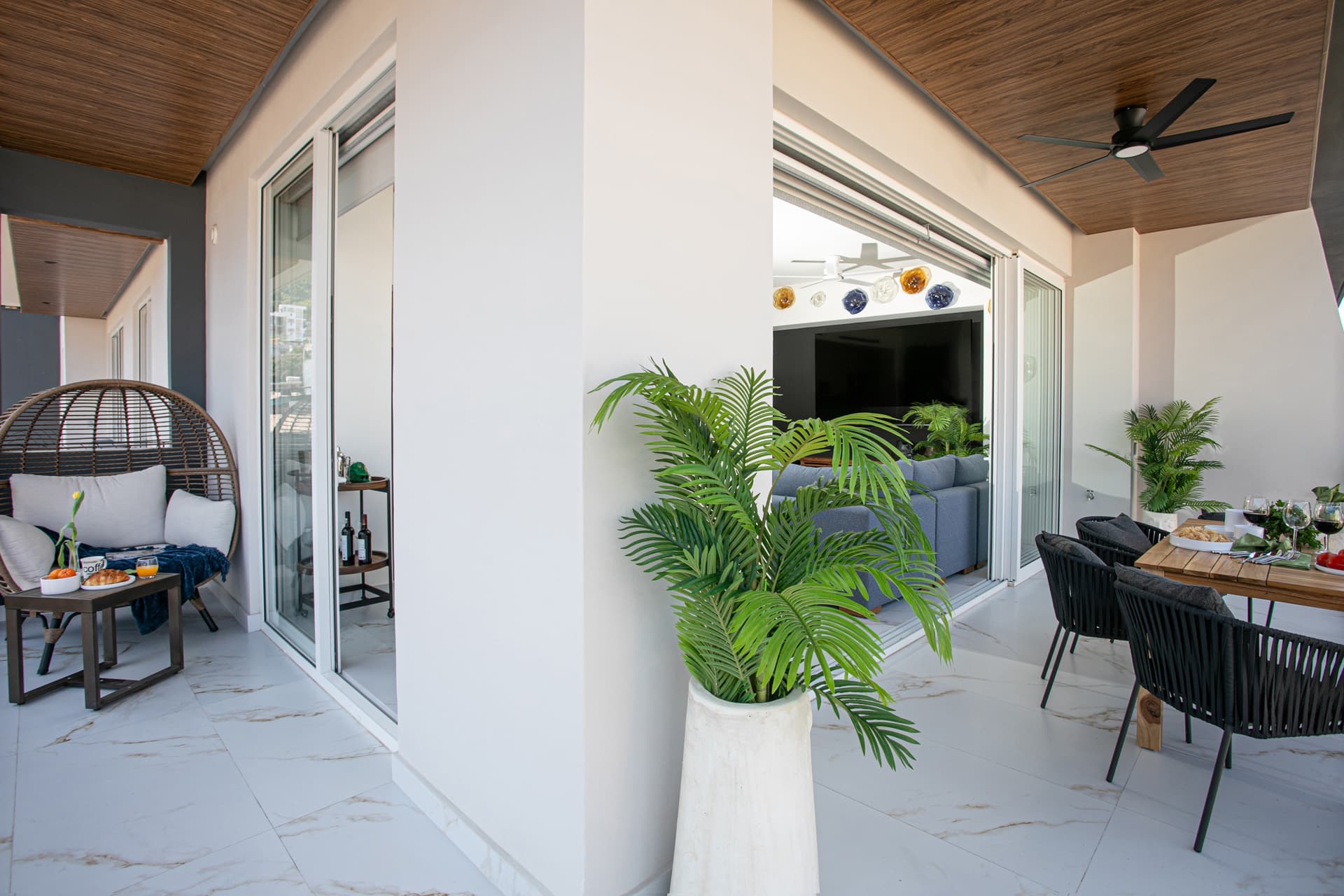Wraparound balcony with dining and relaxation areas, perfect for enjoying the views.