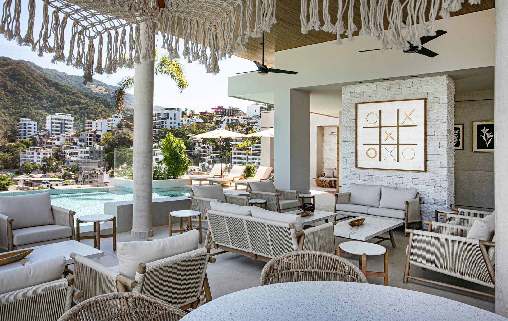 The rooftop is a social haven, offering plenty of spaces to sit, dine, enjoy a drink, or work.