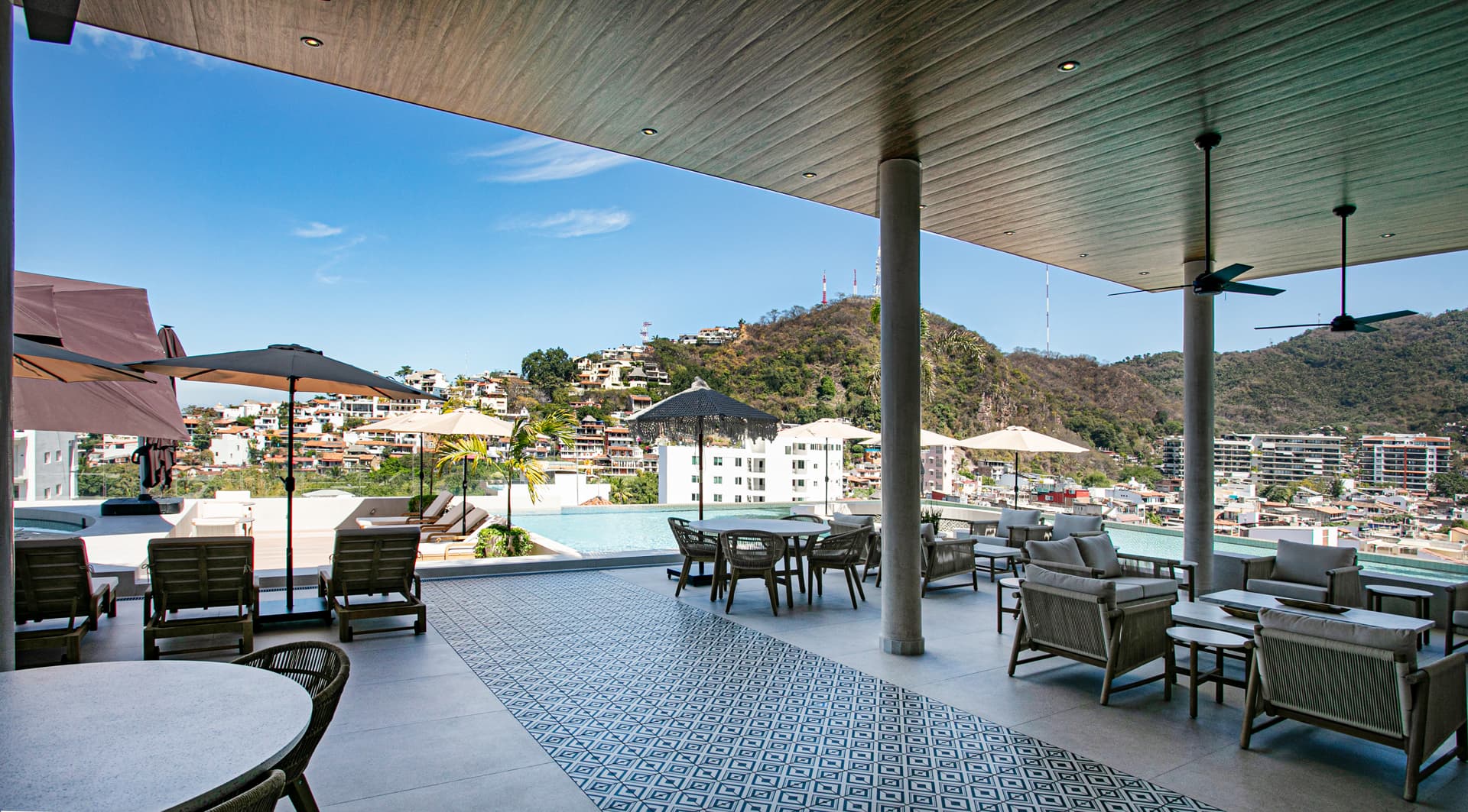 The modern rooftop is expansive, offering a stylish and functional design that makes it both visually striking and comfortable for all.