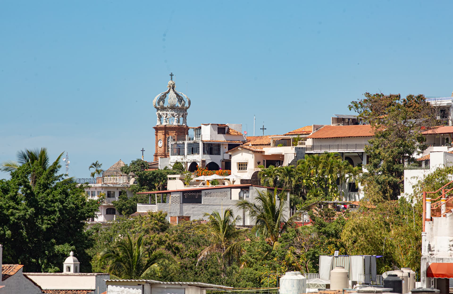 The iconic Our Lady of Guadalupe Church is clearly visible from the balcony.