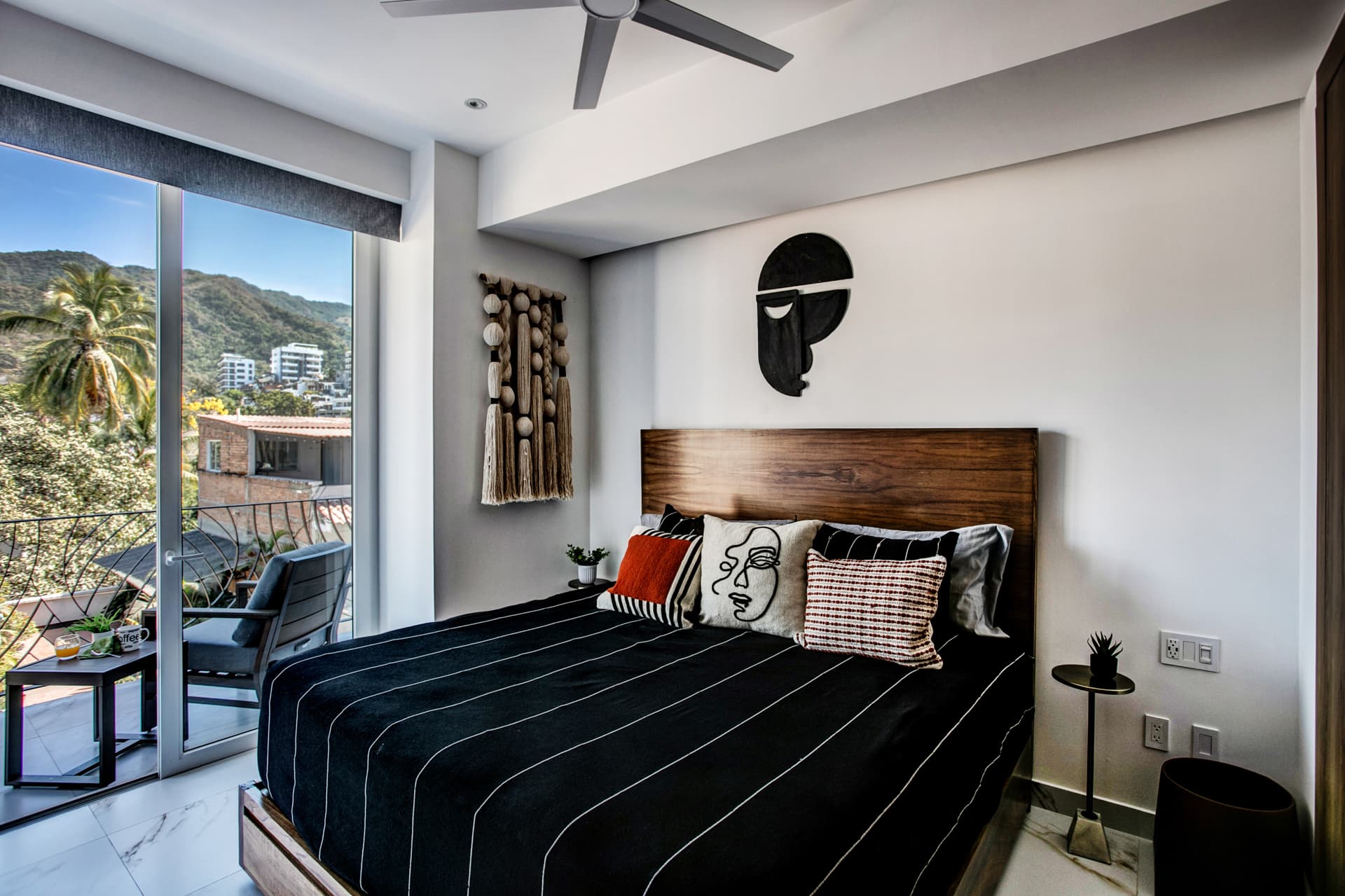 Guest bedroom with a balcony and breathtaking views.