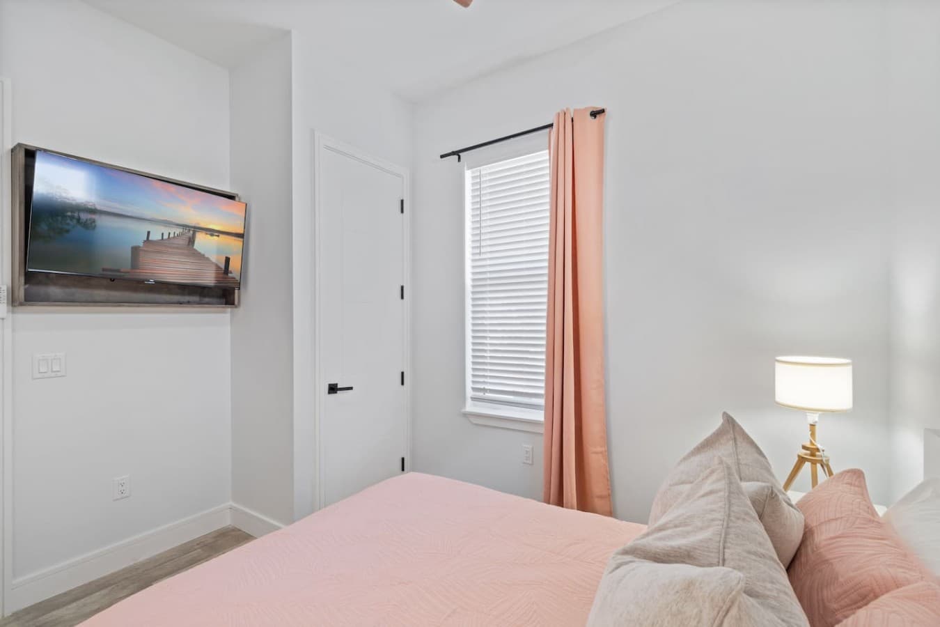 Queen bedroom located downstairs and includes a smart TV