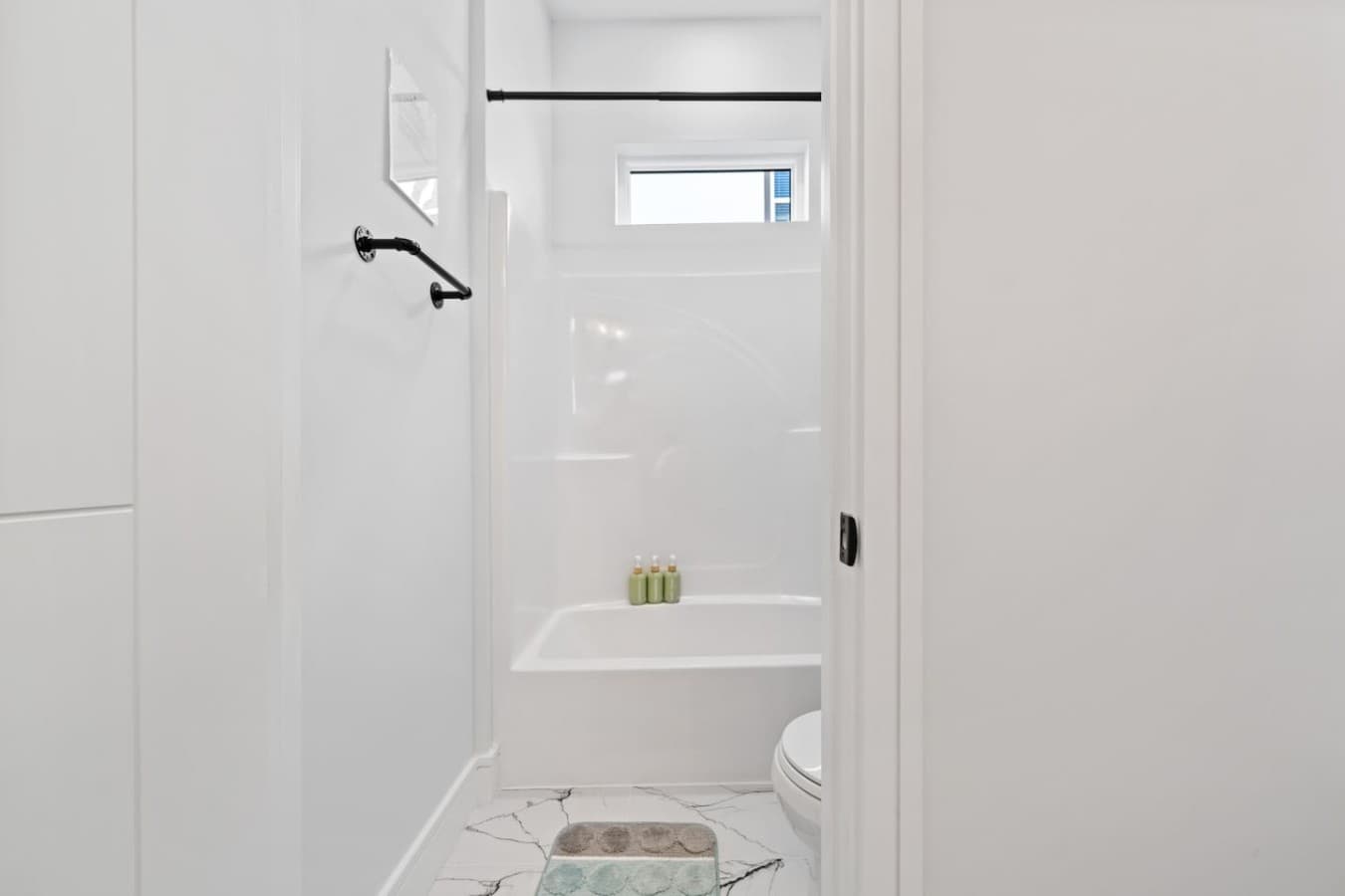 A shower/tub combo full bathroom upstairs