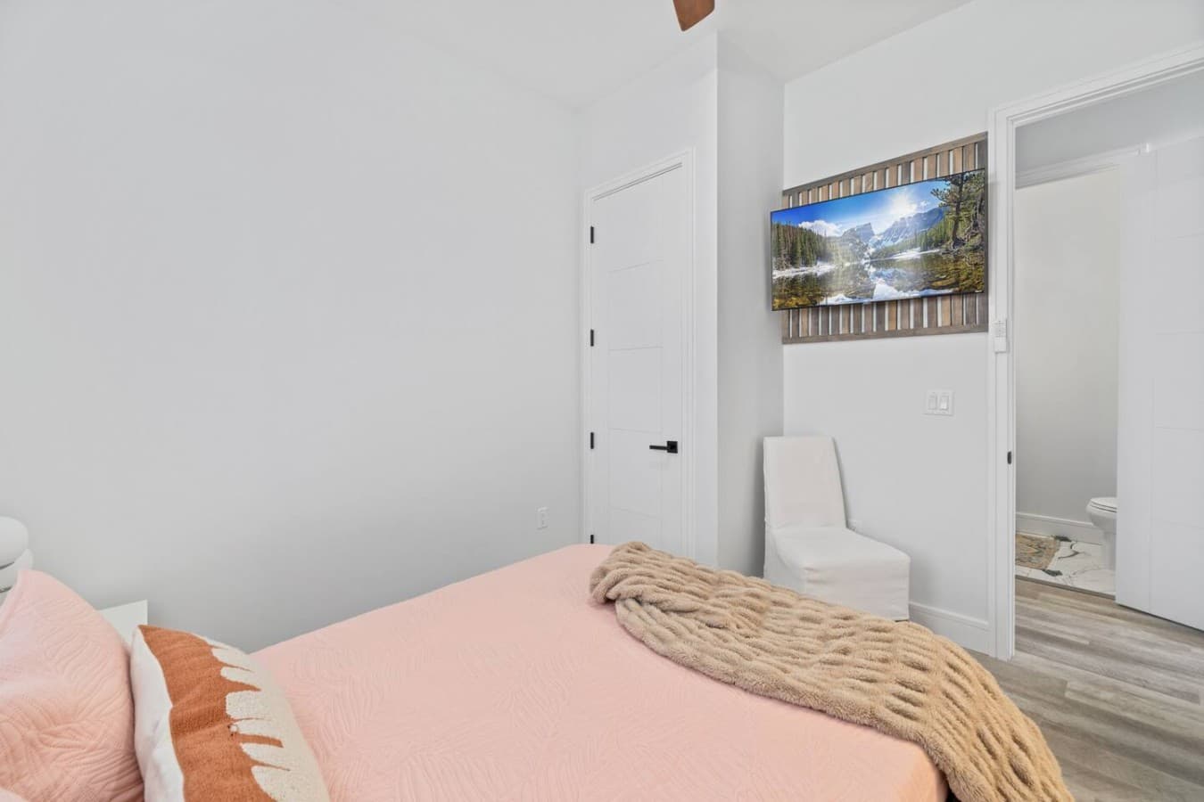Queen bedroom located downstairs with an adjacent jack and jill bathroom
