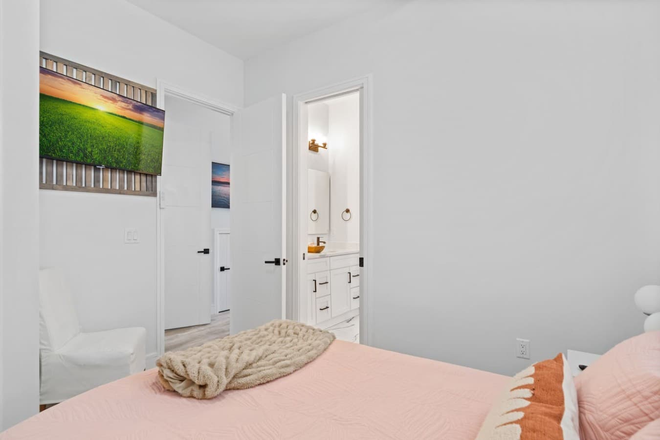 Queen bedroom downstairs with jack n jill bathroom and large smart TV