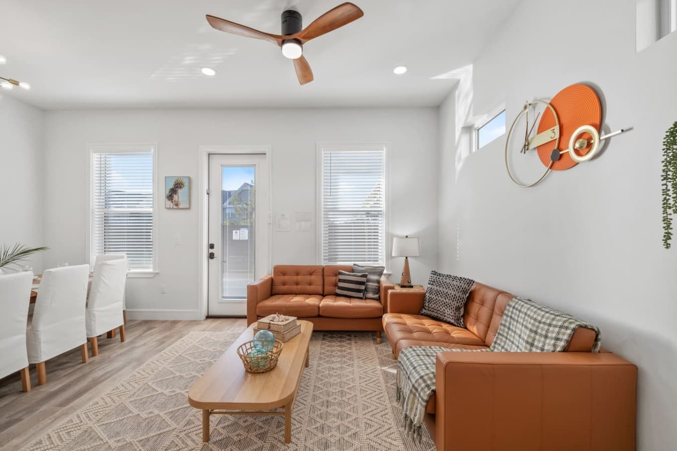 A cozy living room located on the main level with direct access to the back patio