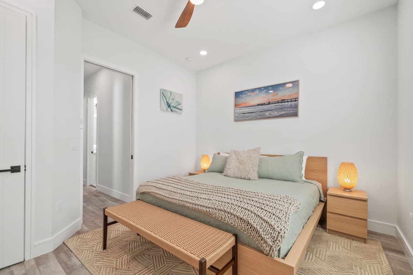 The master bedroom with a modern look located upstairs in the home with en suite bathroom