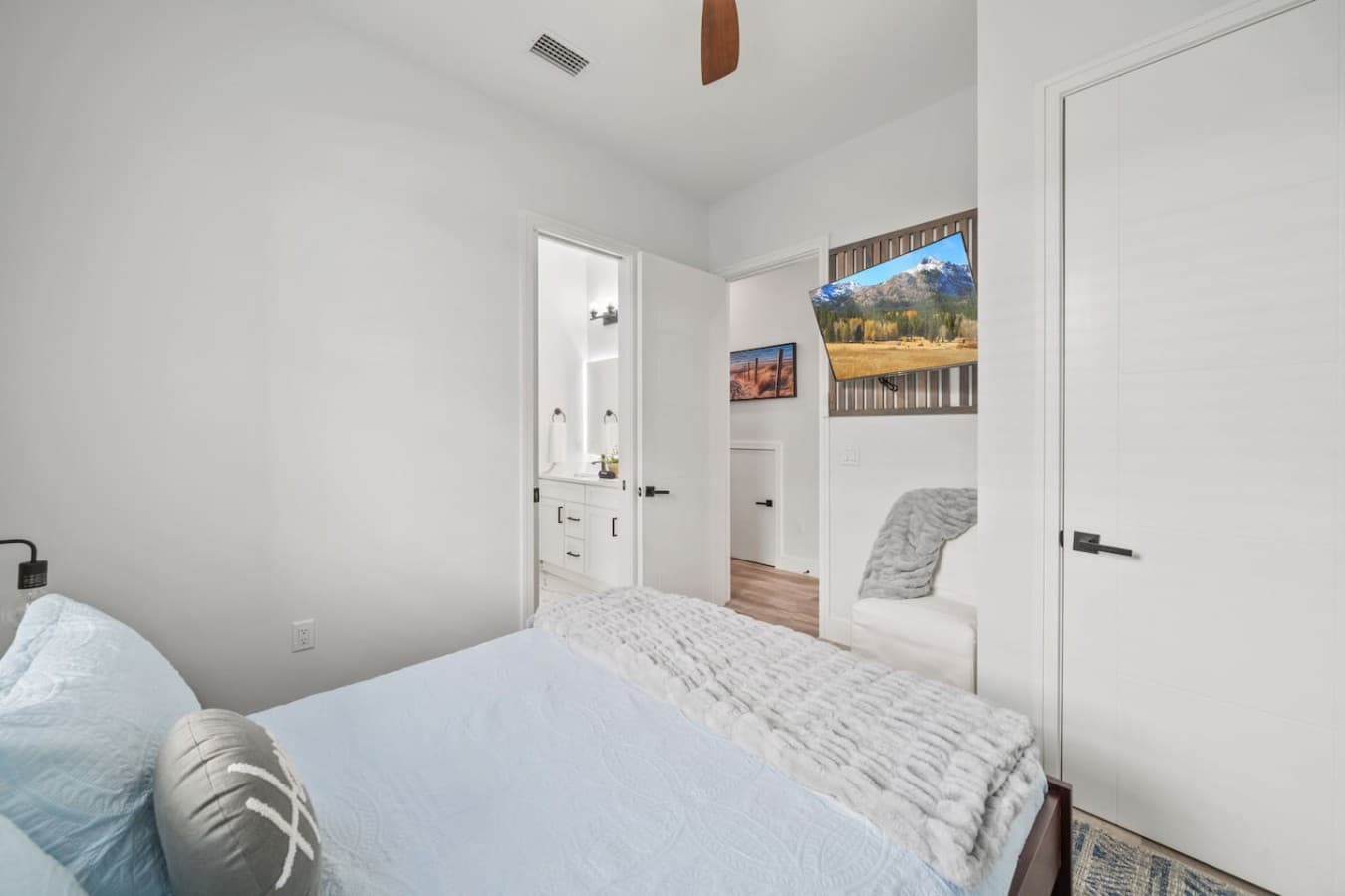 Queen bedroom located on the main level of the home and connected by jack and jill bathroom