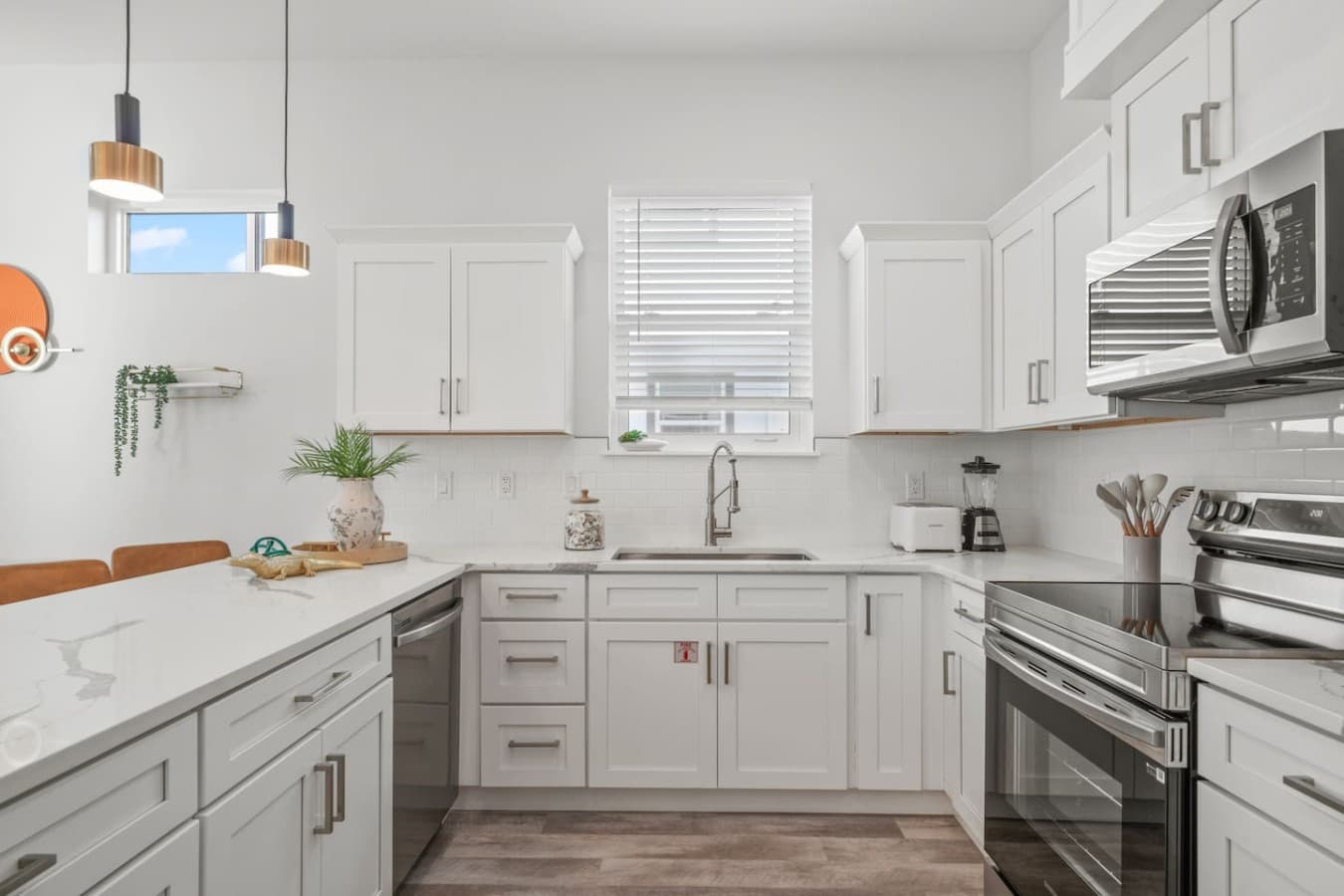 A beautiful kitchen with granite countertops and stainless steel appliances