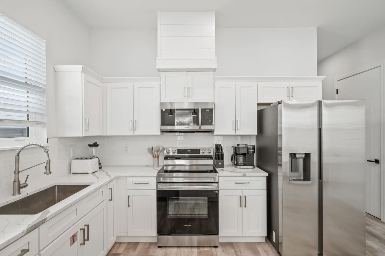 A modern kitchen located towards the back of the home on the main level