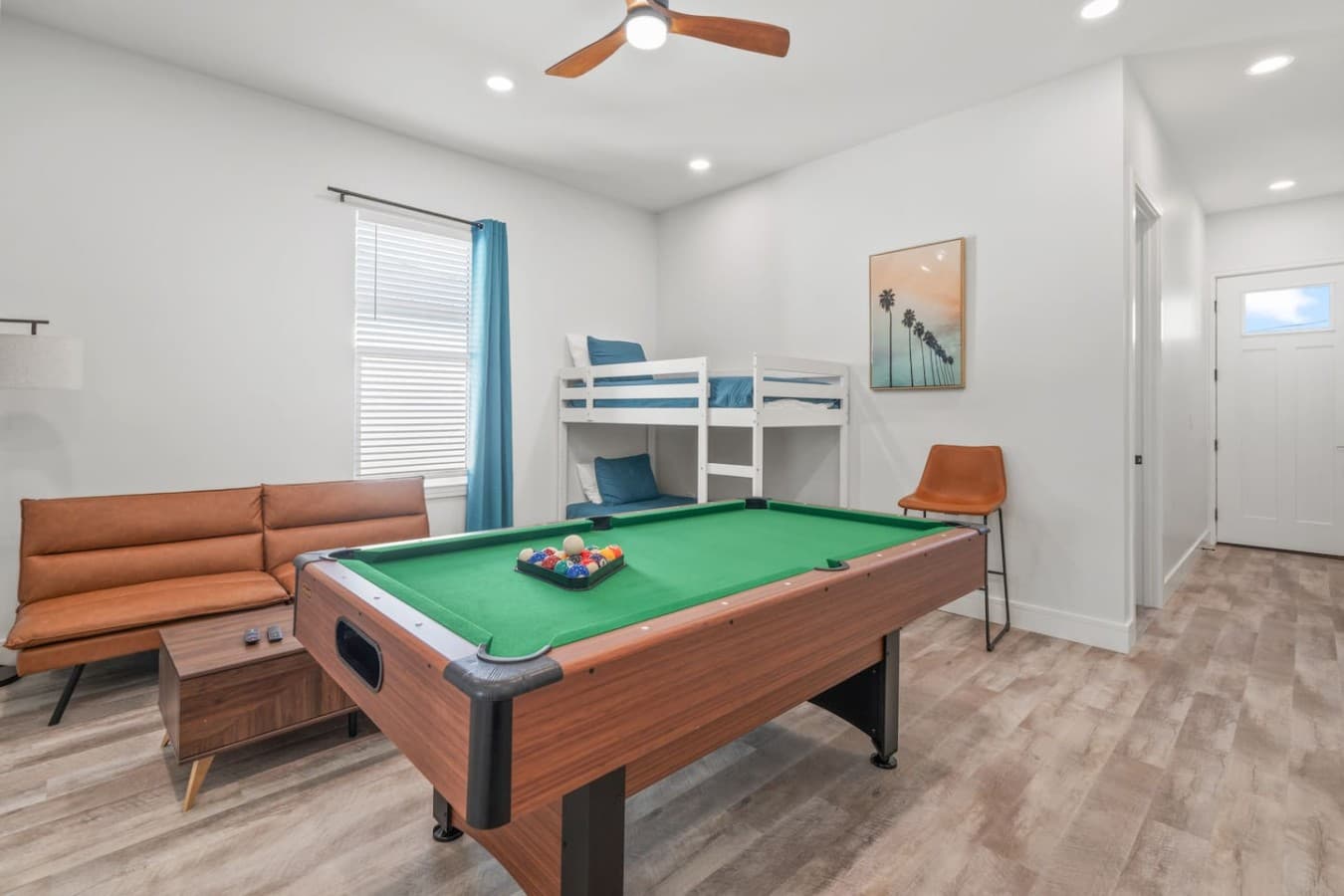 A second living space located upstairs which includes a pool table and large smart TV (as well as additional beds)
