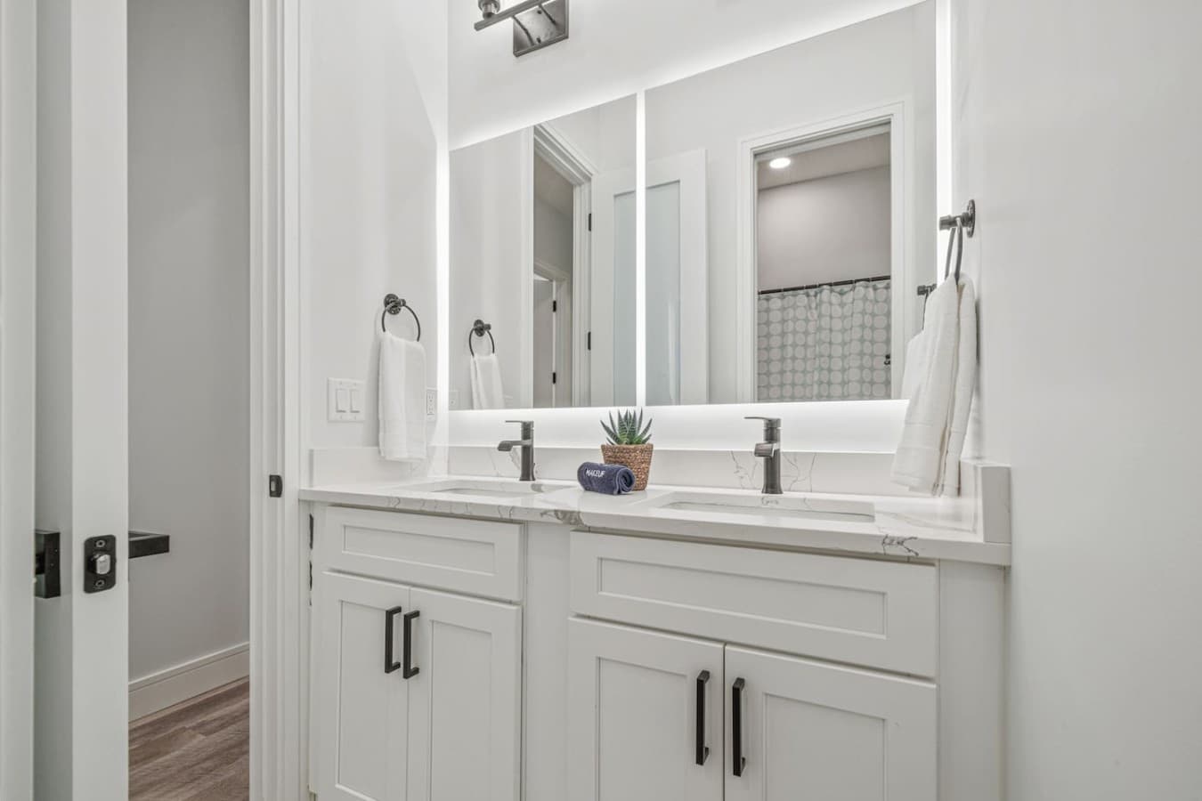 Upstairs bathroom with dual vanities to be shared by two bedrooms.