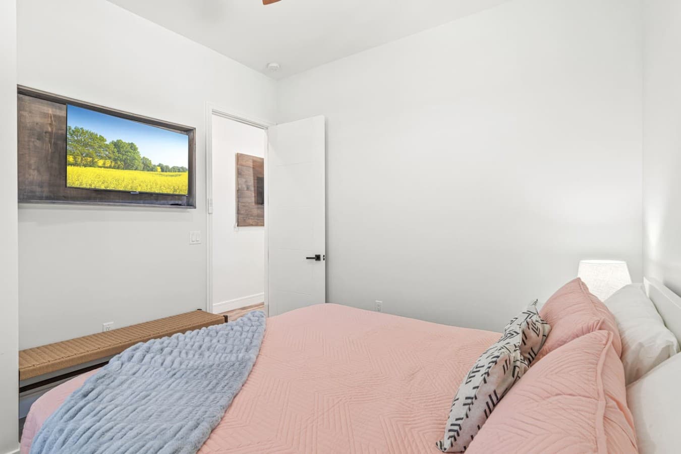 The second king bedroom located upstairs with a large smart TV