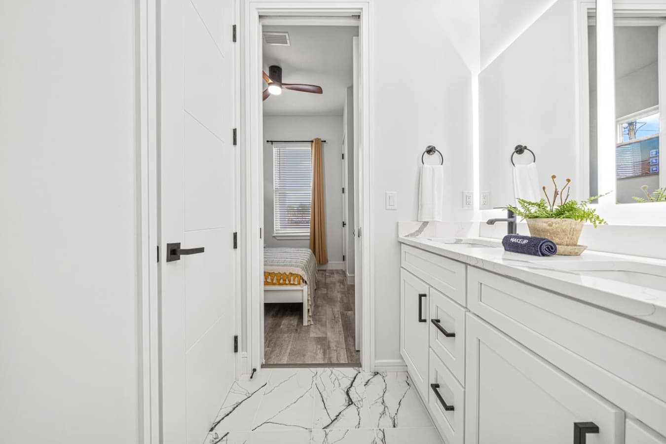 A custom built jack and jill bathroom located on the main level and connected with two queen bedrooms