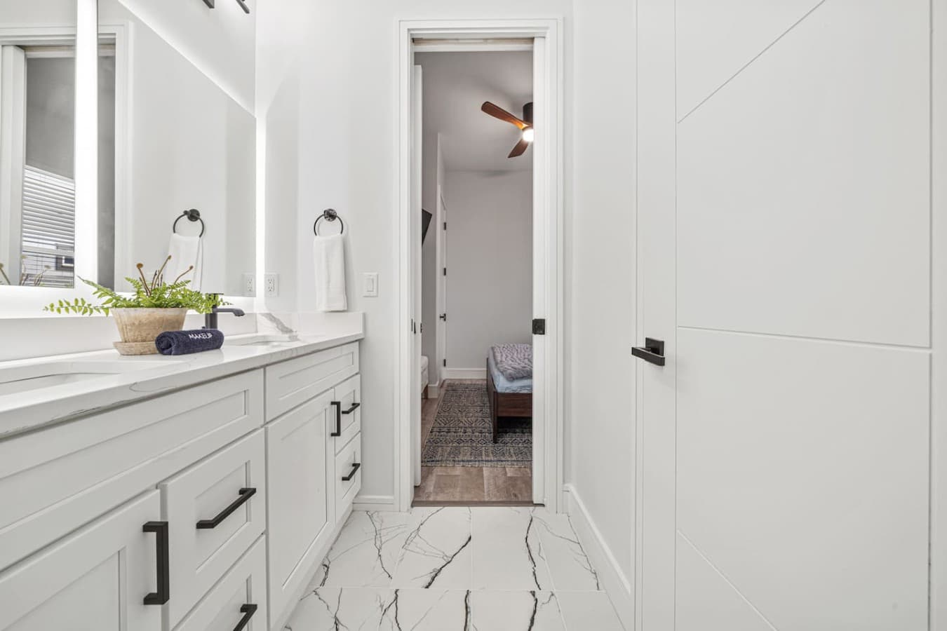 A custom built jack and jill bathroom located on the main level and connected by two queen bedrooms