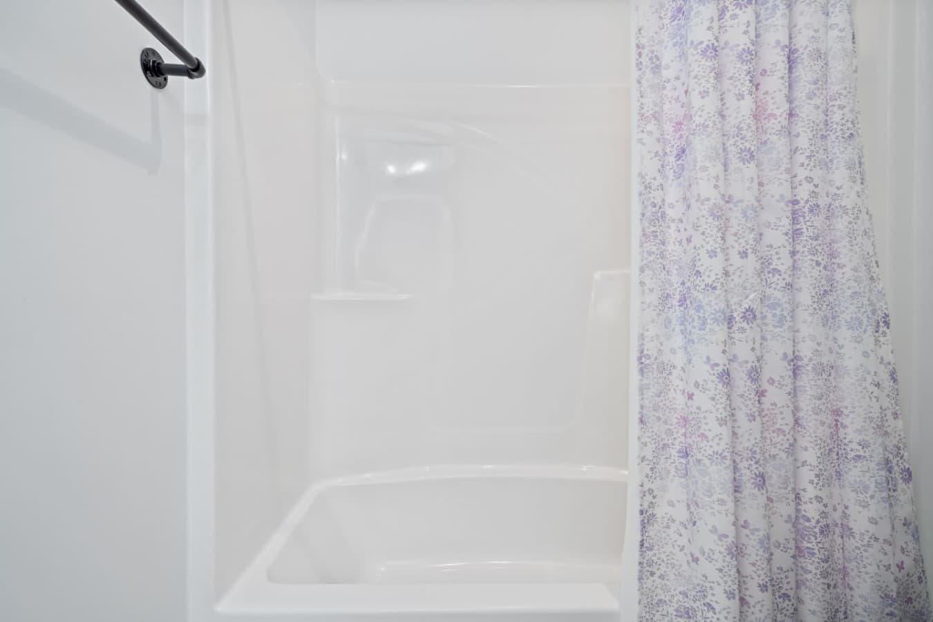 A shower/tub in the jack and jill bathroom downstairs