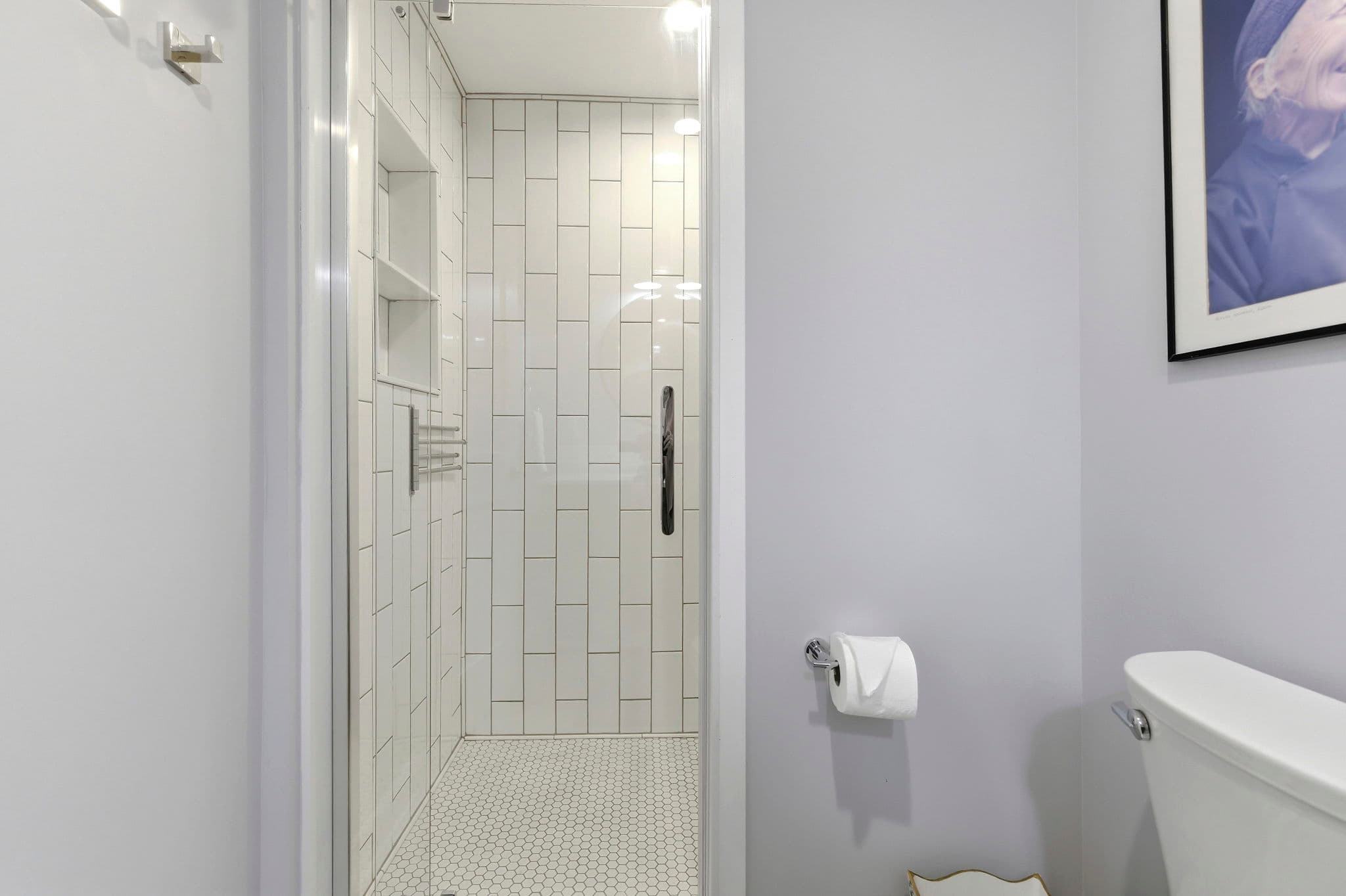 Every shower has a rack like the one in this photo, it is to hold wet bathing suits.
