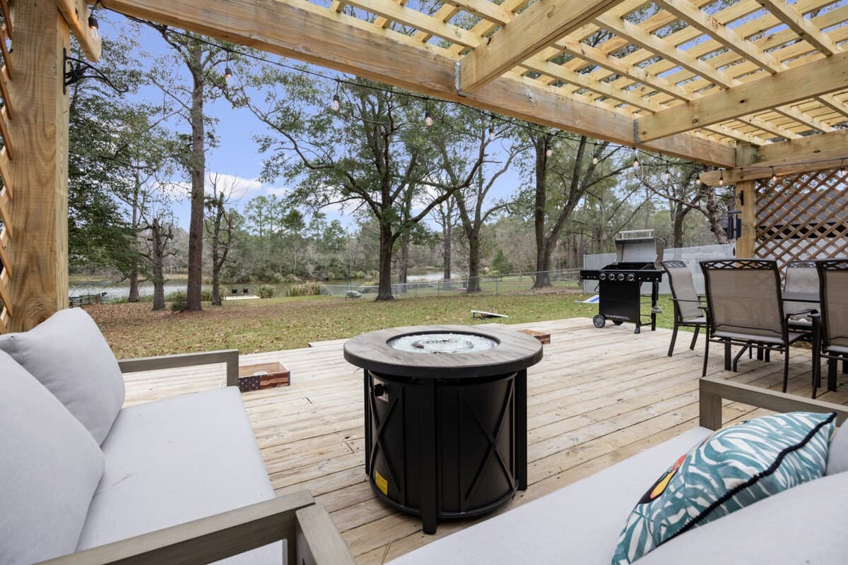 Relax on the deck with comfortable seating, a fire pit, and space to grill and unwind outdoors.