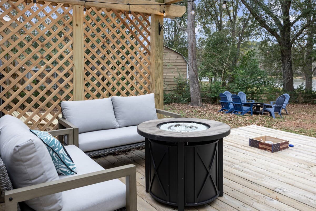 Cozy pergola seating with a fire table—perfect for relaxing evenings, conversation, and unwinding outdoors.