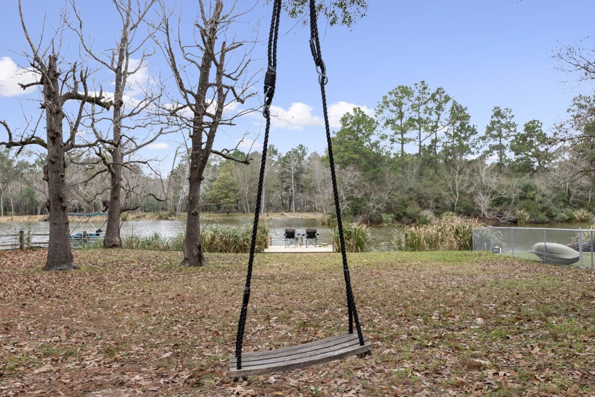 Quiet backyard swing with peaceful water views—perfect for slowing down and enjoying the moment.