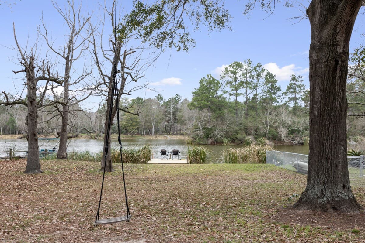 A peaceful backyard setting with room to unwind—imagine quiet mornings, gentle breezes, and evenings winding down as the water glows in the distance.