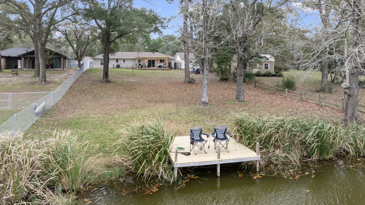 Private dock with seating overlooking the water, offering a peaceful spot to relax, unwind, or enjoy the natural surroundings.