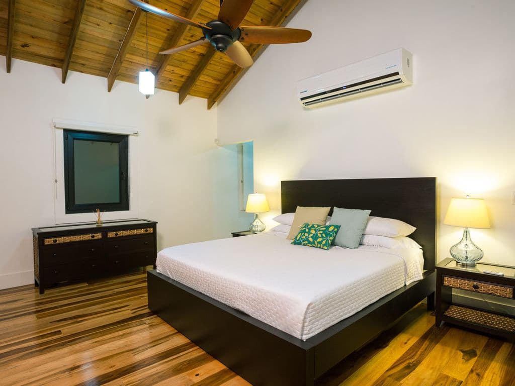 The master suites at Vivaro Beachfront feature soaring vaulted ceilings and private balconies with commanding Caribbean views. These luxury king sanctuaries include en-suite baths and sit steps from a secluded private beach.