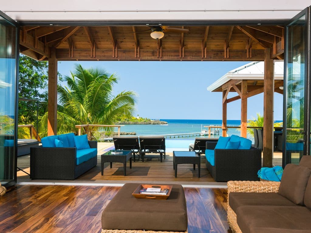 Our expansive deck features deep covered areas, providing a cool retreat from the tropical sun. Enjoy the outdoors all day long with plenty of shaded seating and dining spaces that capture the breeze while keeping you perfectly comfortable and protected. 