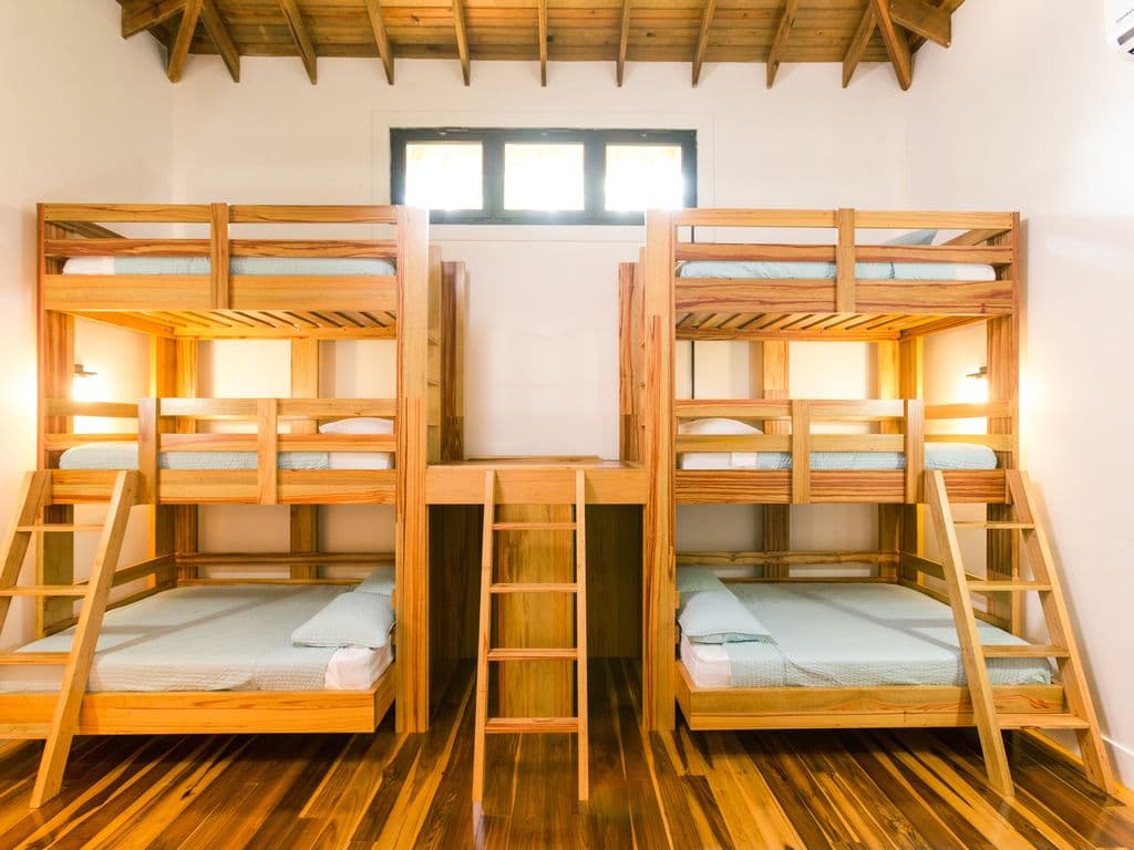 🌿 Custom-built for comfort and fun! Our spacious bunk room features sturdy, handcrafted beds and an airy design—the perfect stylish "home base" for kids or friends to recharge after a day on the water. 😴