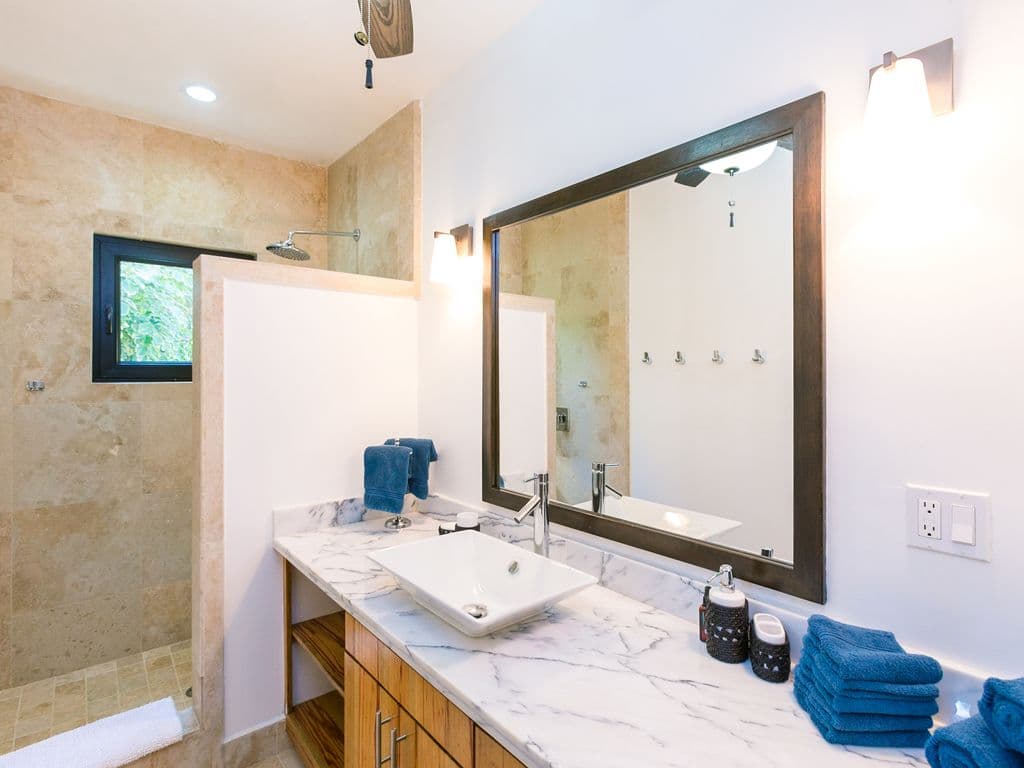 Our lofted suite offers the perfect blend of style and privacy. Enjoy an integrated ensuite featuring a sleek vanity and a private, enclosed toilet for added comfort. It’s a bright, secluded retreat within your island home. 🚿✨