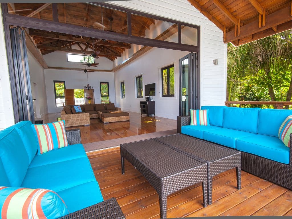 Our expansive deck features deep covered areas, providing a cool retreat from the tropical sun. Enjoy the outdoors all day long with plenty of shaded seating and dining spaces that capture the breeze while keeping you perfectly comfortable and protected. 