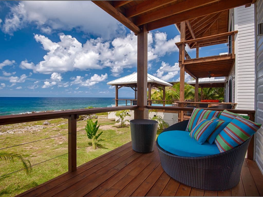 📖 A peaceful, elevated escape. This cozy nook offers a quiet retreat for reading or morning coffee, catching the best island breezes and offering a unique perspective of our tropical paradise. 🌿☕