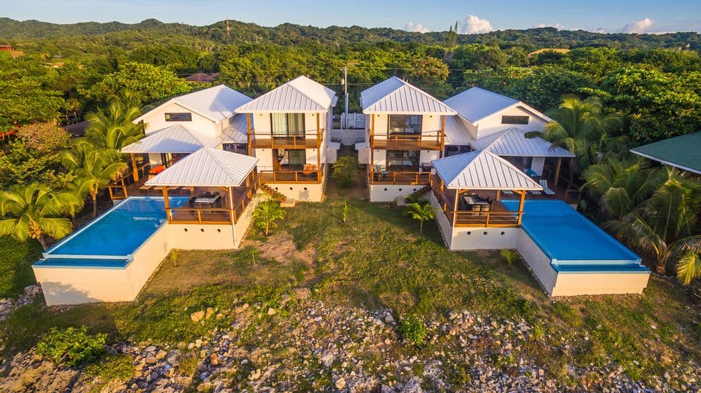 Even with a full house of 24 guests, the aerial layout shows multiple distinct zones—like the private balconies, the massive main deck, and separate living areas—ensuring it never feels crowded.