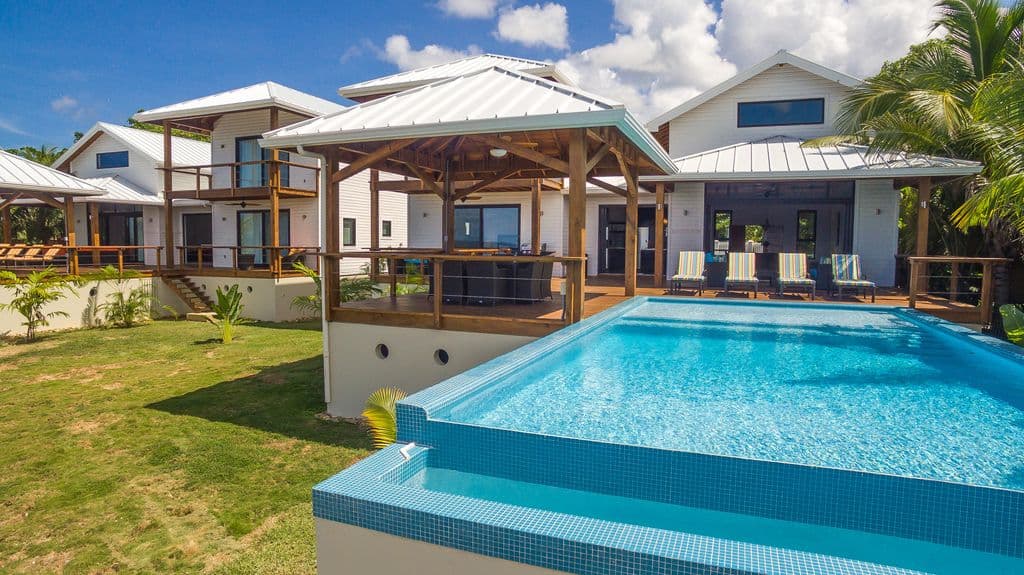 For those who prioritize relaxation, the pool includes a spacious tanning ledge This shallow 9-inch platform is the ultimate spot to place a submerged lounger, allowing you to stay cool in the water while soaking up the tropica