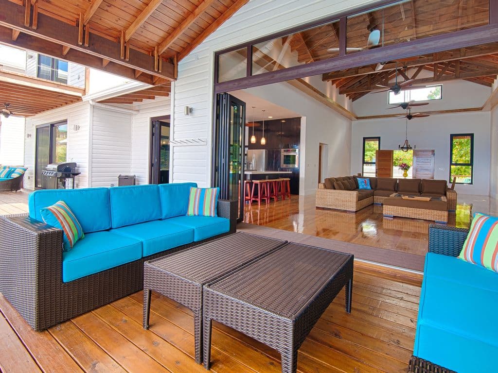 Our expansive deck features deep covered areas, providing a cool retreat from the tropical sun. Enjoy the outdoors all day long with plenty of shaded seating and dining spaces that capture the breeze while keeping you perfectly comfortable and protected. 