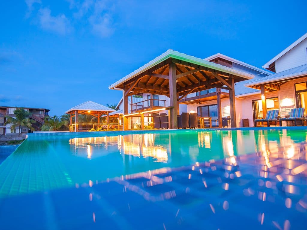 🌿 Watch the Caribbean sky catch fire from the Vivaro South deck. Our infinity pool reflects the golden sunset, creating a breathtaking backdrop for evening drinks and total relaxation. The ultimate golden hour experience. 🌅🥂