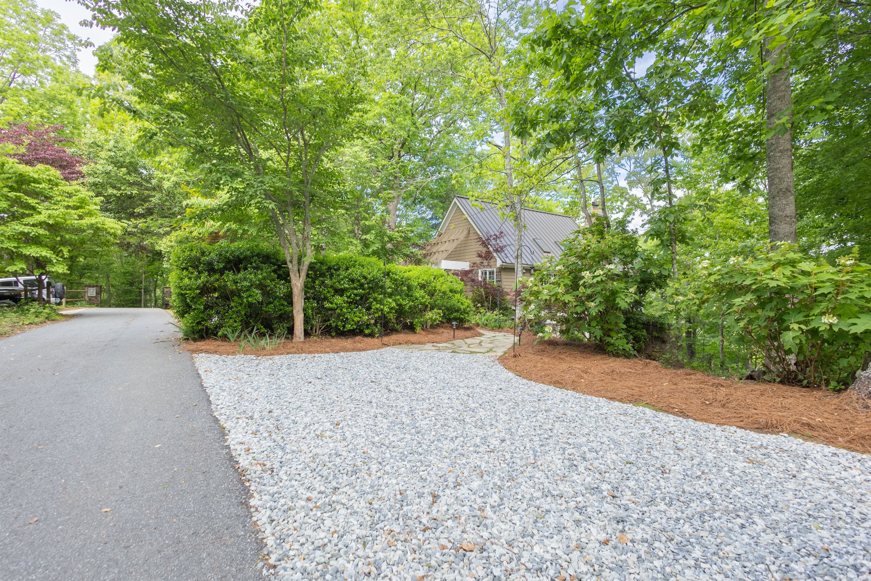 Plenty of gravel parking is available, making it easy for guests to spread out and access the home comfortably.