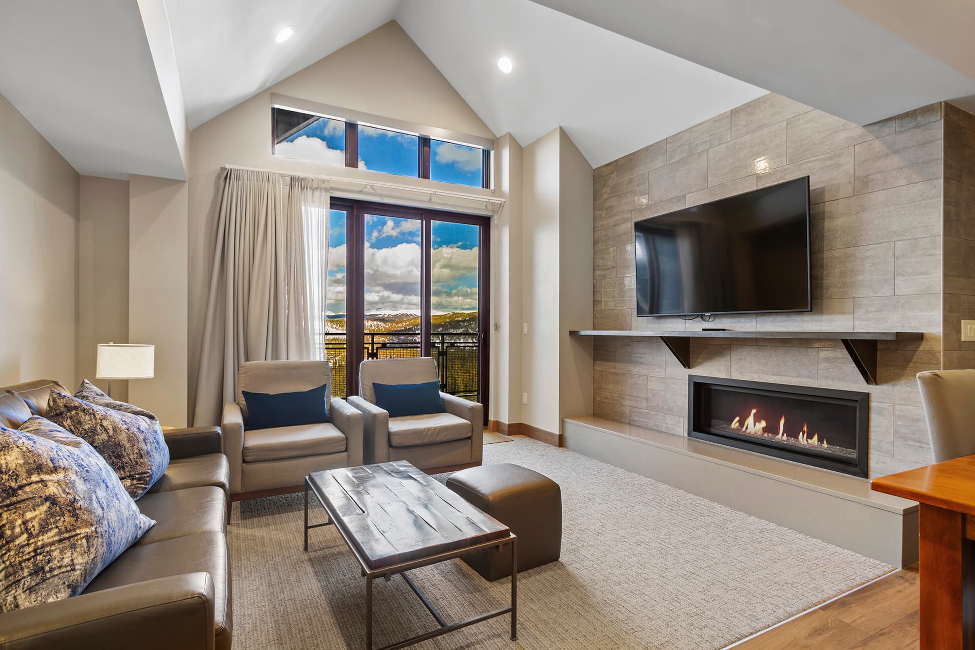 Living room with gas fireplace & deck