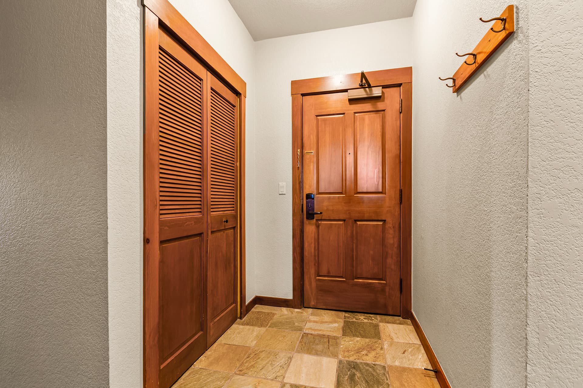 Entrance with storage closet