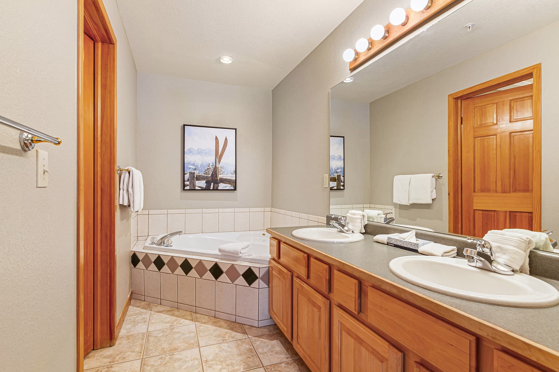 Large ensuite bathroom with jetted tub