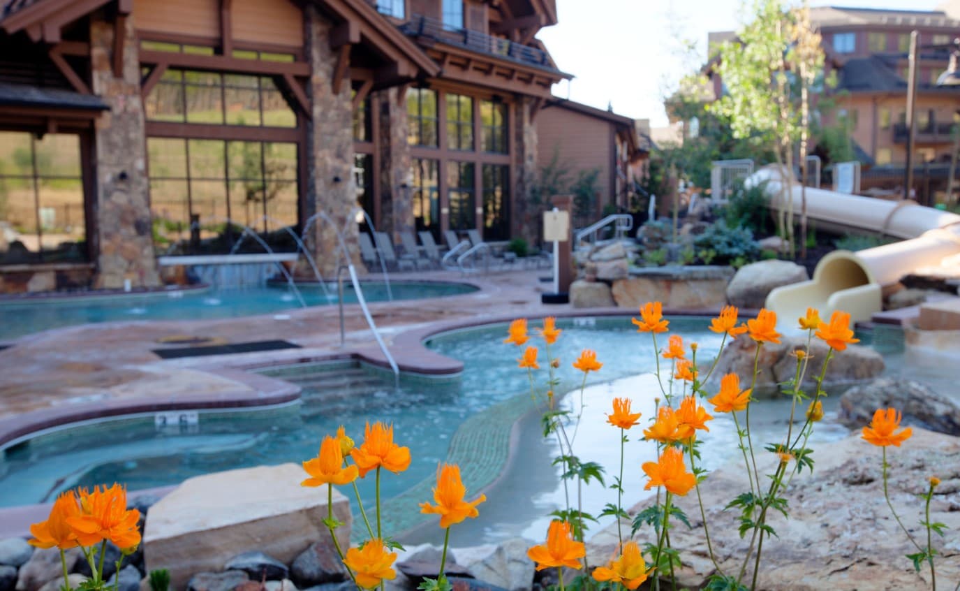 Outdoor pool & slide during the Summer