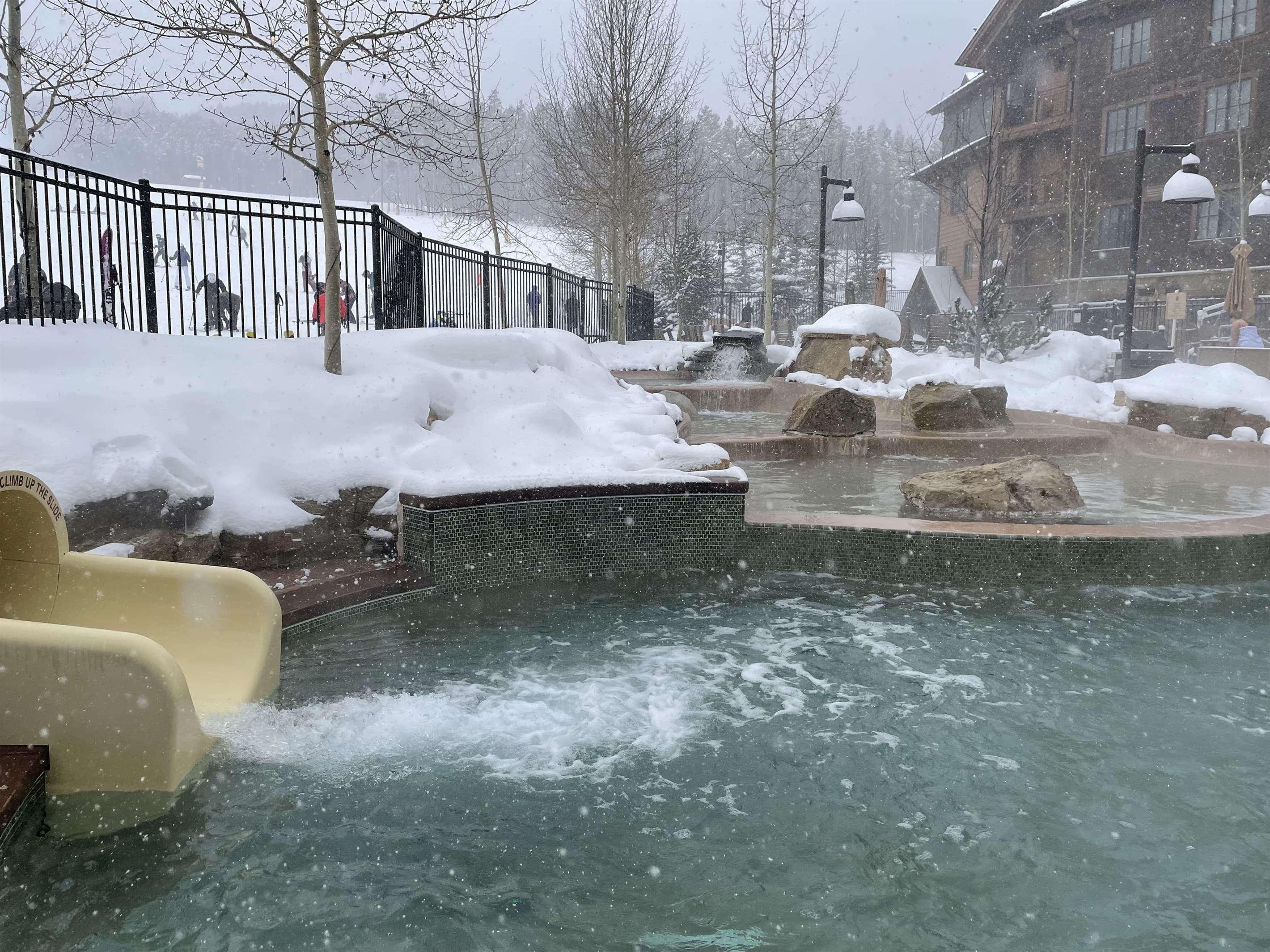 Outdoor heated pool slide