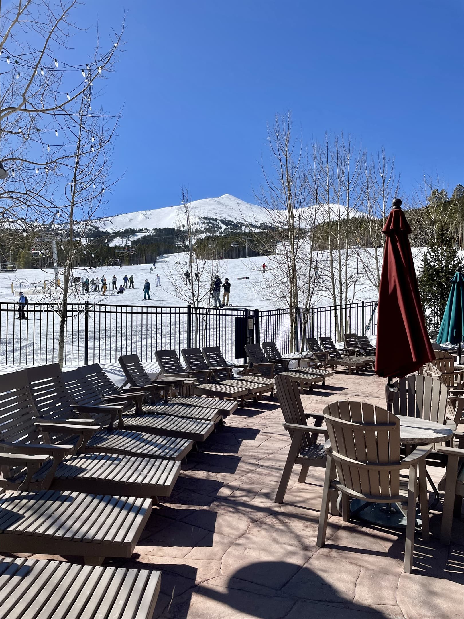 Lounge chairs near pool and ski run